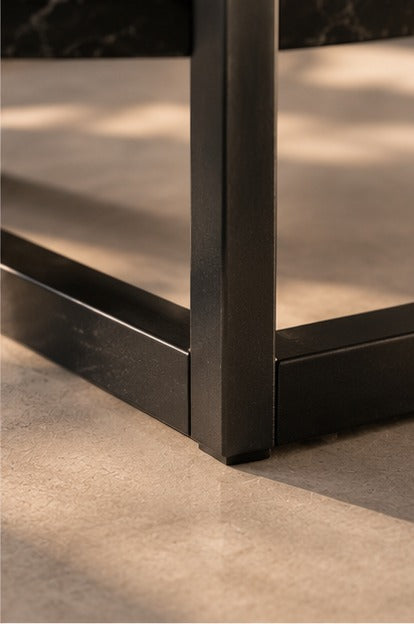 Close-up of the foot of the black frame